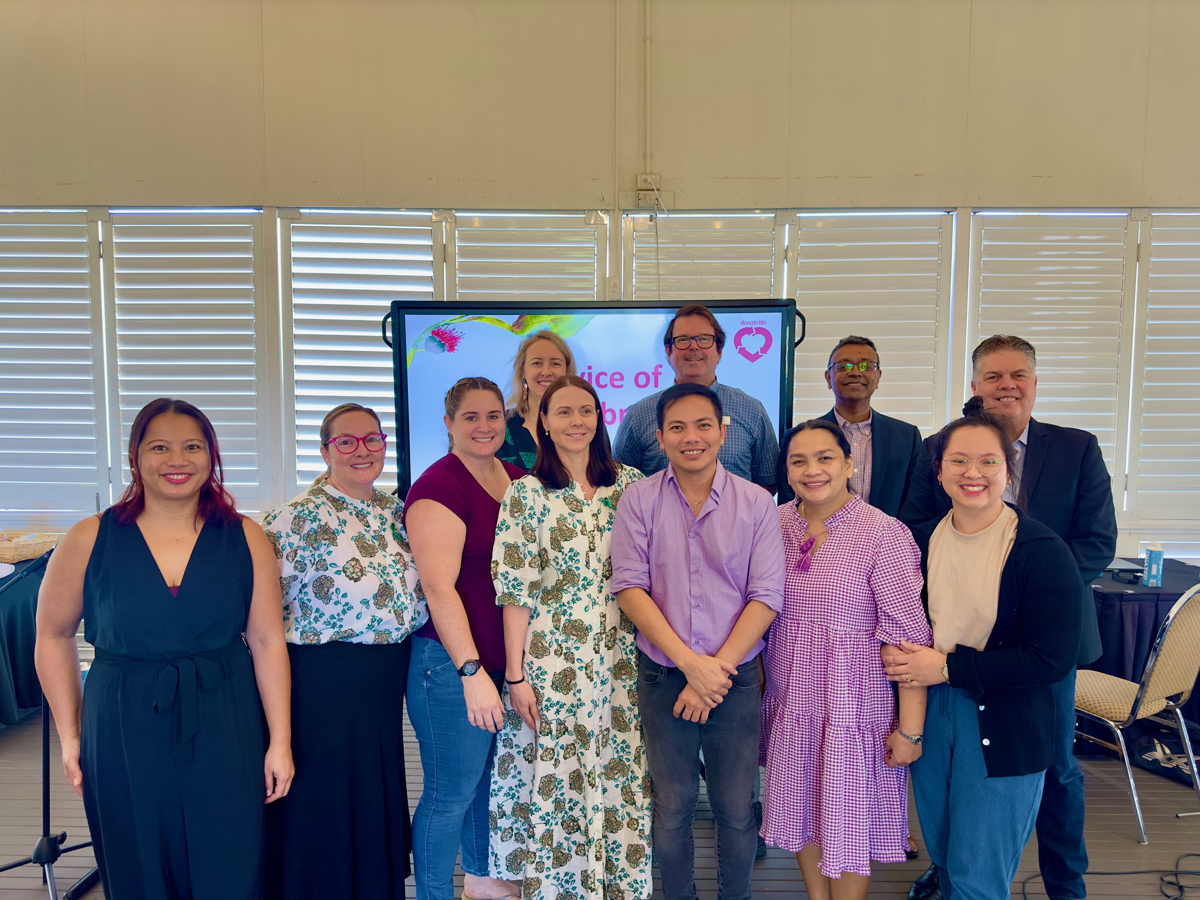 Eleven staff from Townsville hospital pose for a photo.