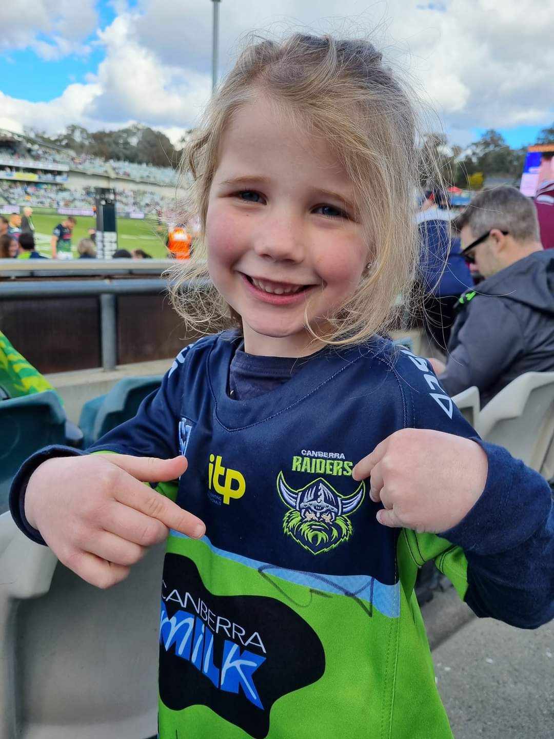 Raiders supporter wearing her jersey for Jersey Day