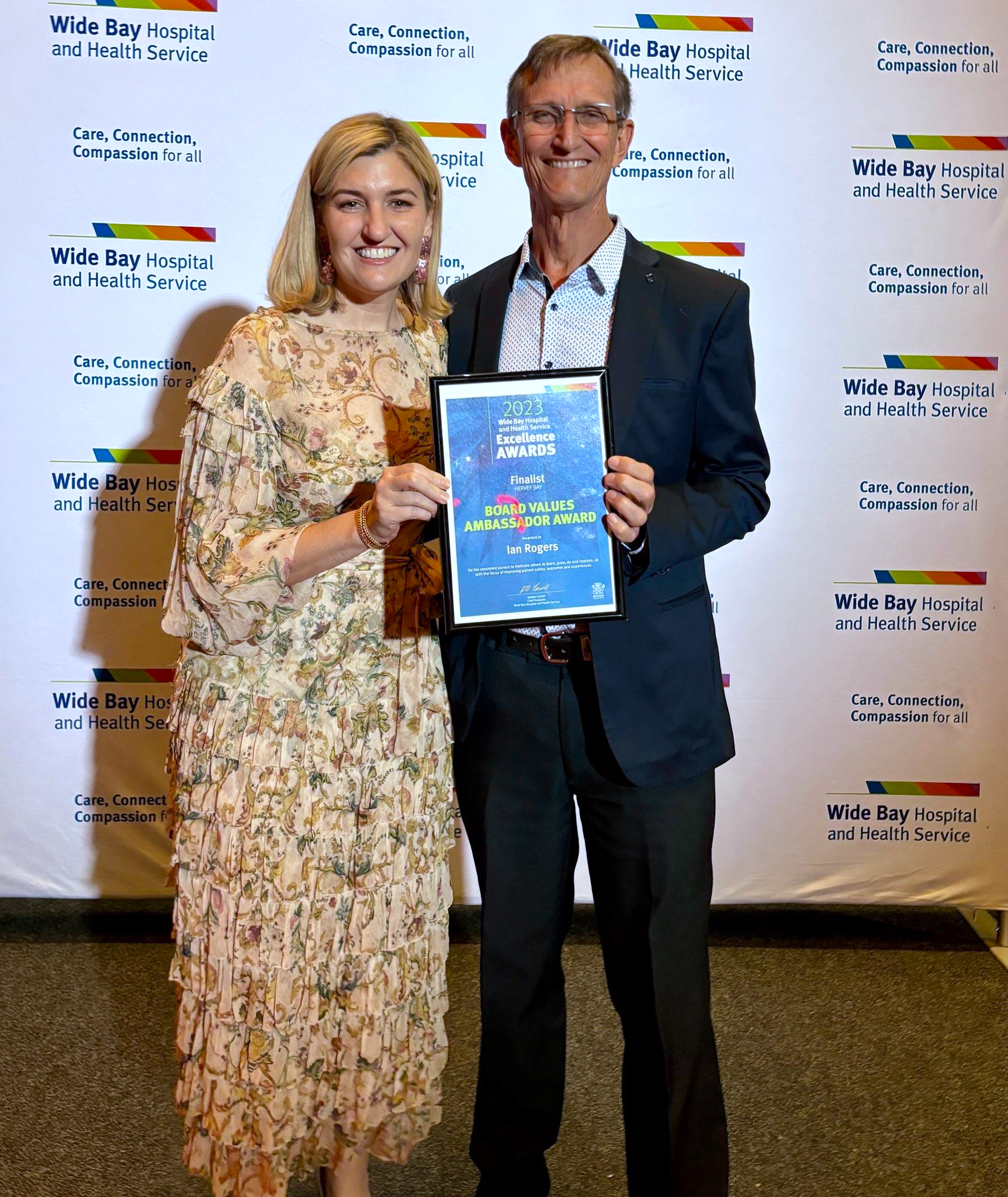 a photo of Ian Rogers and QLD Minister Shannon Fentiman, holding Ian’s finalist certificate for the Board Values Ambassador Award.