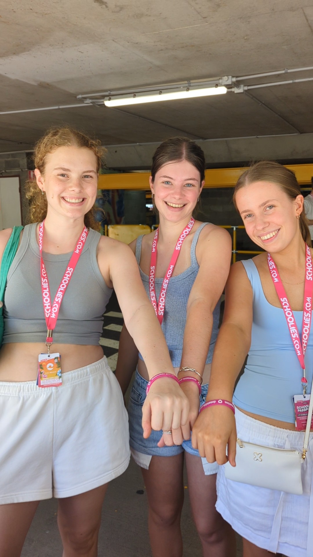 Schoolies attendees show off their DonateLife wristbands after visiting the DonateLife stand at Schoolies Registration Day.