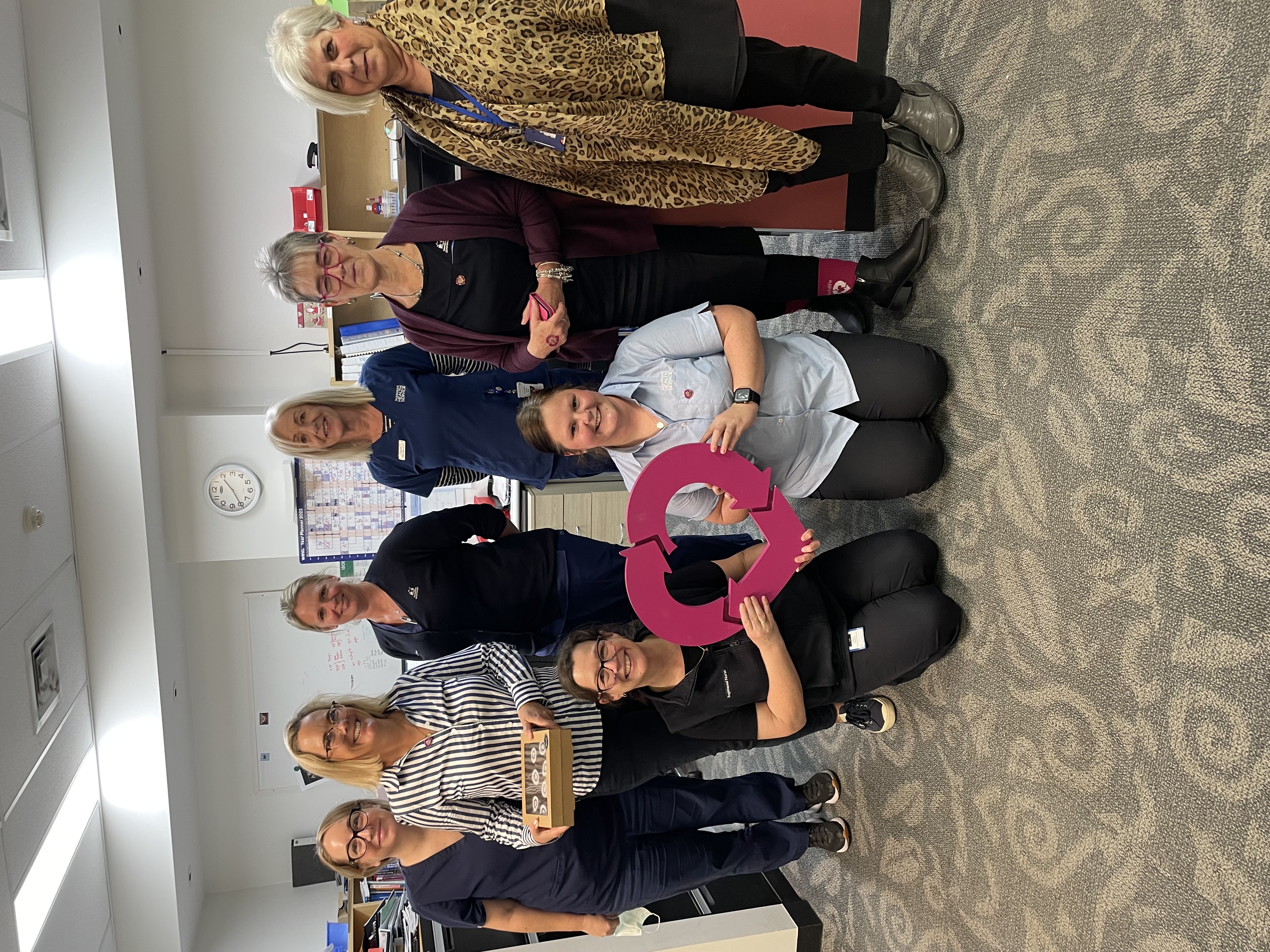 Photo of DonateLife TAS staff holding DonateLife heart