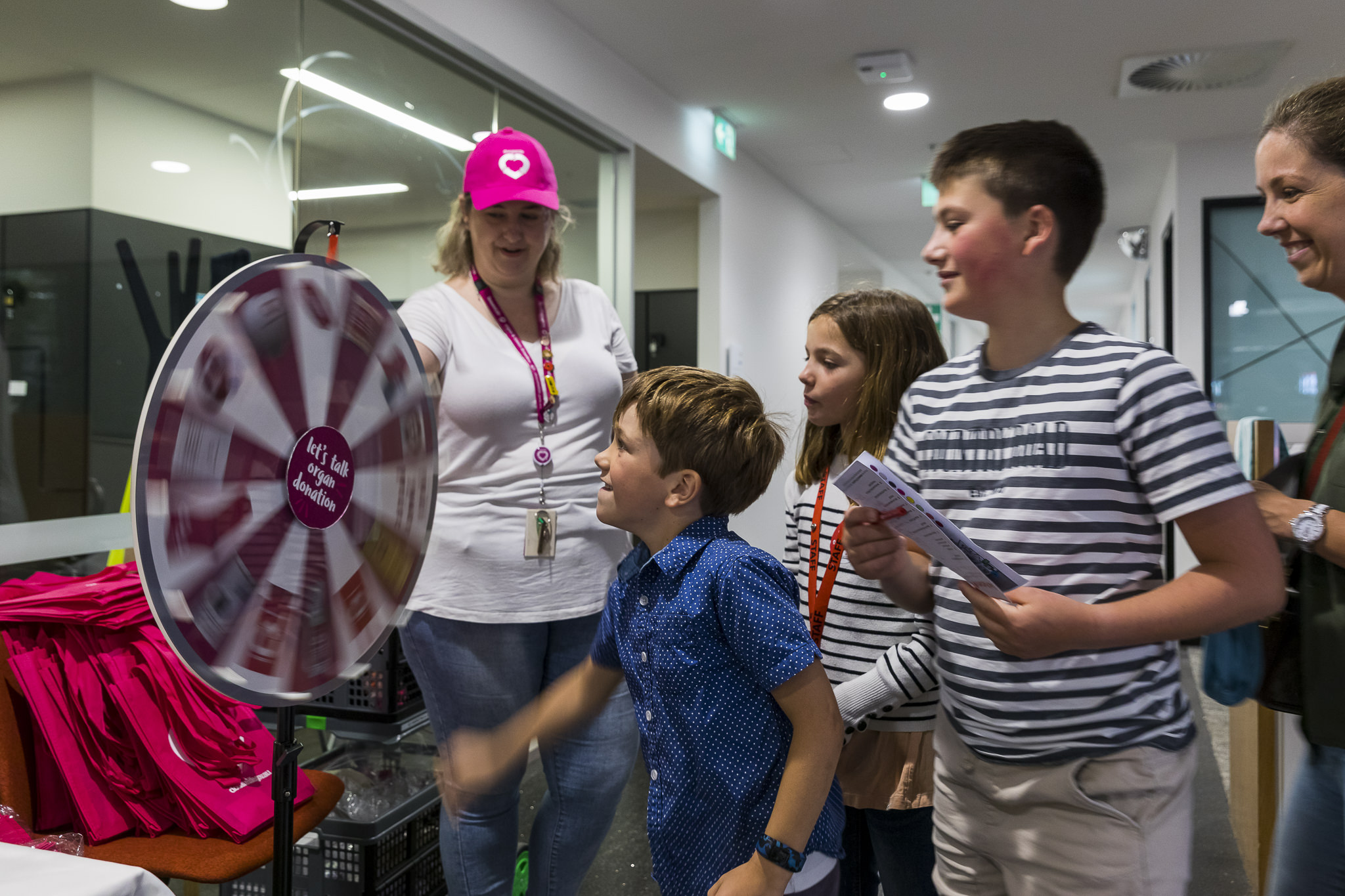 Photo of little boy spinning the wheel to win DonateLife merch