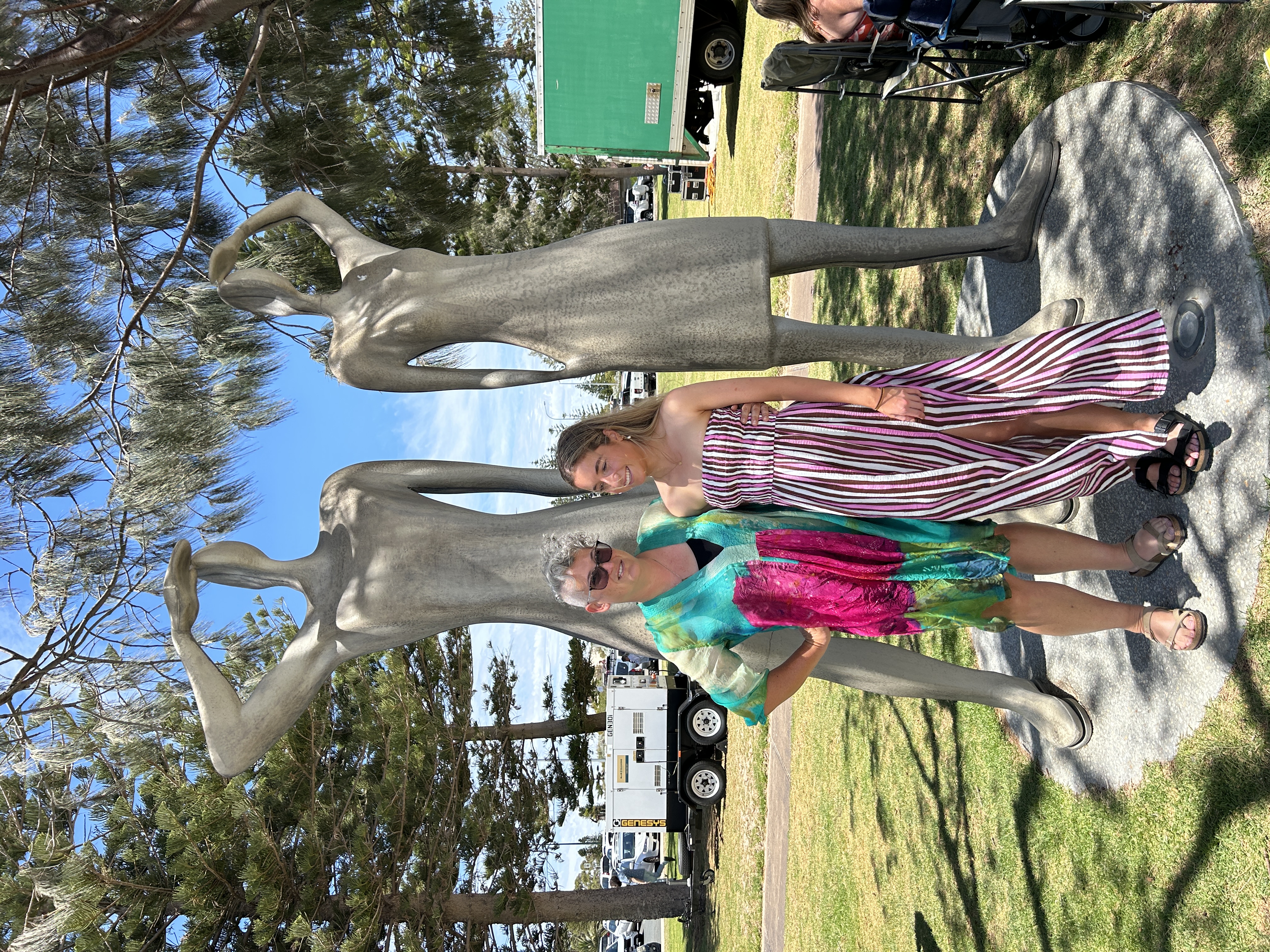 Guest speakers Sarah Kerr and Chelna Mare in front of two statues at the City Beach Foreground.